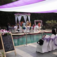 pool party, pool location, purple white combination decoration, simple party decoration, event management company