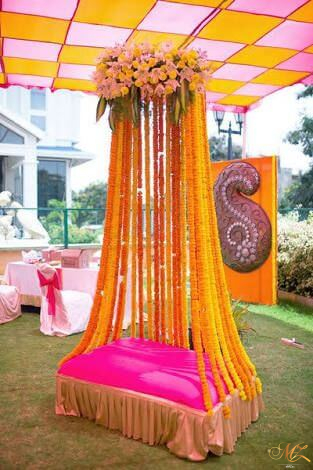 wedding mehndi ceremony, wedding planner in pune, backdrop, yellow, flowers, yellow and red decoration